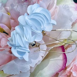 Golden white floral drop earrings.